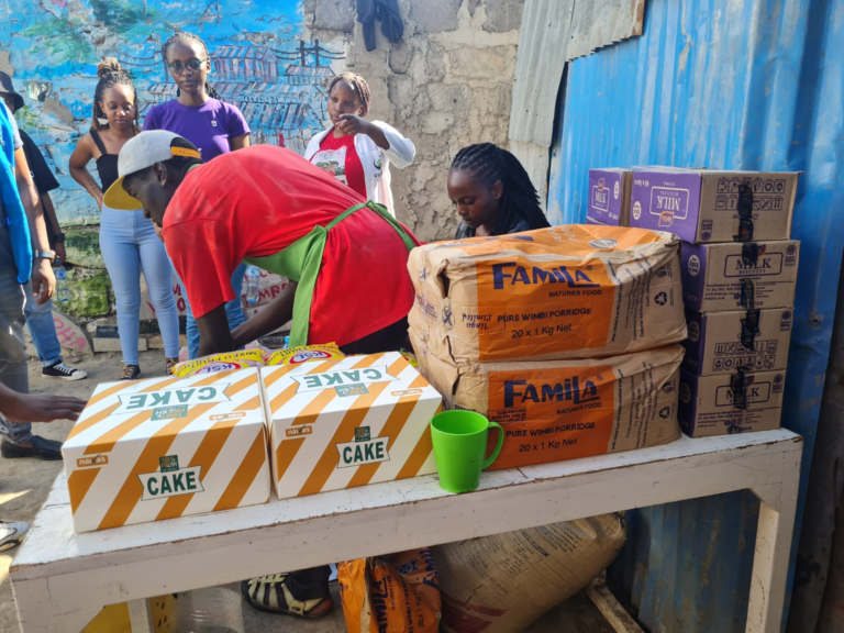Rotaract Magharibi donating of Essentials to VICCO-Mukuru Sinai Slums